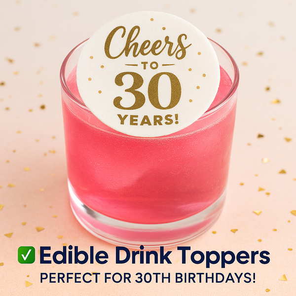 Pink drink with a 'Cheers to 30 Years!' edible drink topper on a beige background with gold confetti.
