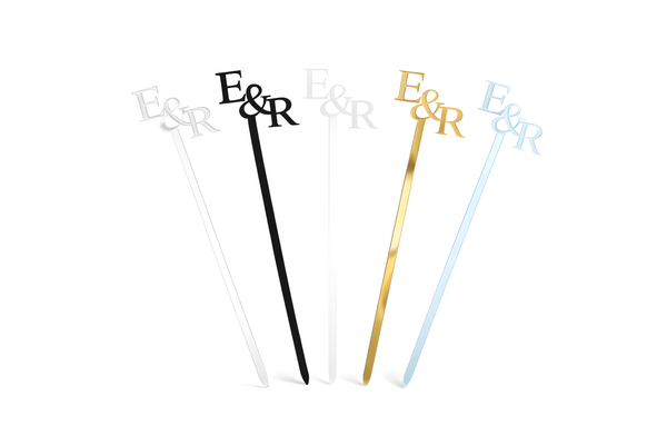 Five cocktail stir sticks with 'E&R' initials in different colors on a white background