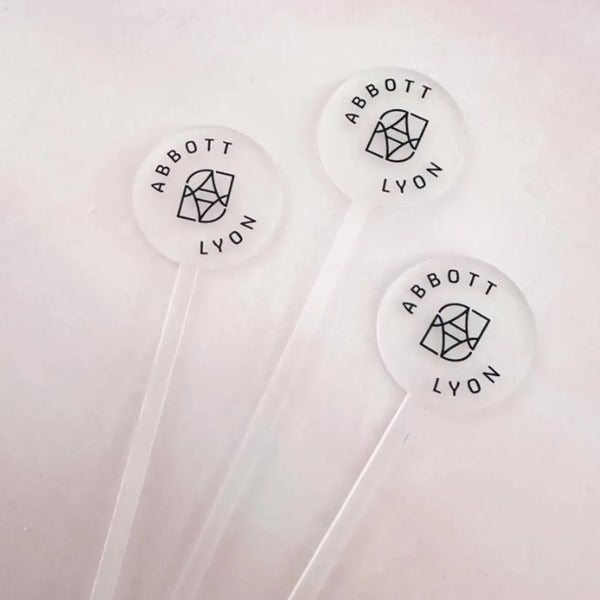 Personalized acrylic swizzle sticks with business branding
